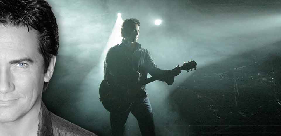 Impressionist performing with a live band on an intimate downtown Las Vegas showroom stage