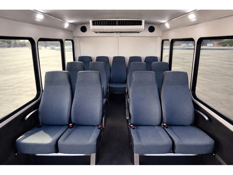 AIRPORT SHUTTLE Share-A-Ride Transfer - Spacious shuttle interior features comfortable seating and climate-controlled comfort for every ride.