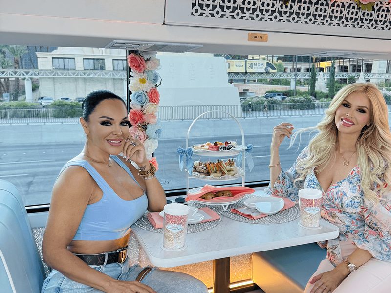 Café on the Strip - Two guests enjoy afternoon tea aboard Café on The Strip while taking in views of the Las Vegas Strip.