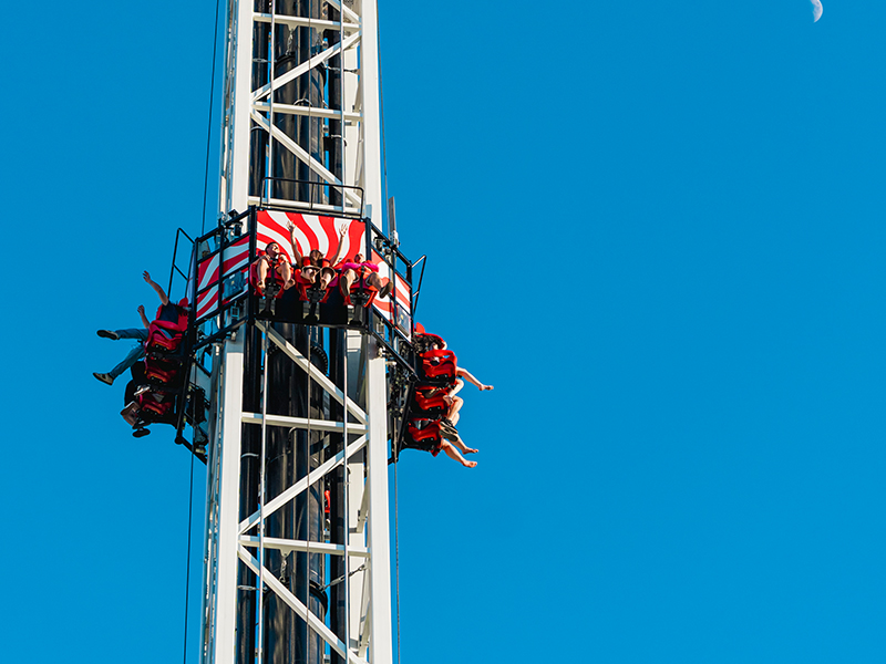 Eye Dropper - Suspended high above the ground, riders take in breathtaking views moments before the exhilarating drop.