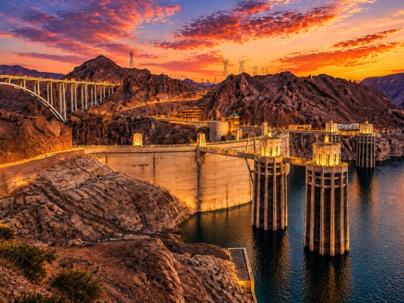 Hoover Dam Small Group Sunset Tour with BBQ Dinner Experience - Hoover Dam illuminated at sunset