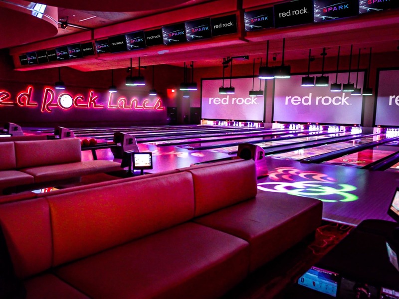 Plush lounge seating and colorful lighting give Red Rock Lanes a sleek, energetic atmosphere for bowling and socializing.