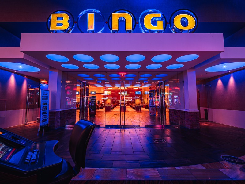 The Bingo room entrance glows in vibrant blue and purple, setting the stage for a lively gaming experience.