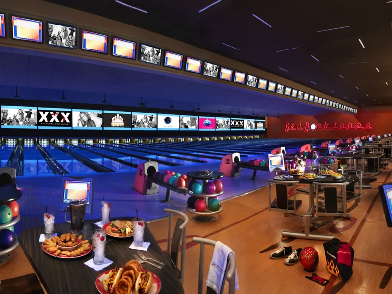 Red Rock Lanes combines bowling, food and drinks in a spacious entertainment setting lined with glowing lanes and screens.