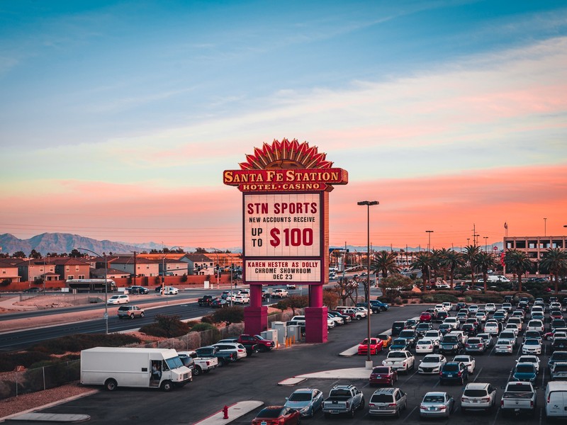 The Santa Fe Station marquee stands against a colorful Las Vegas sky, welcoming guests to the hotel and casino.