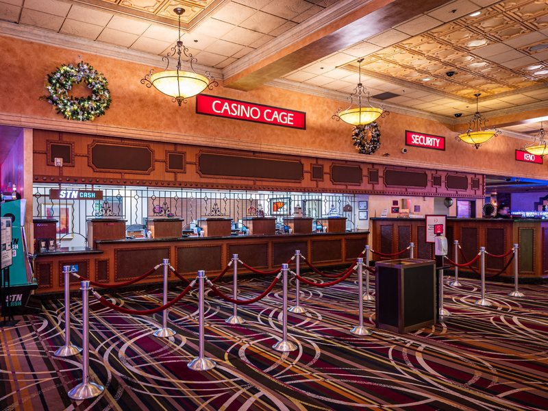 The casino cage provides a central location for guest transactions, with dedicated service windows and clear wayfinding.