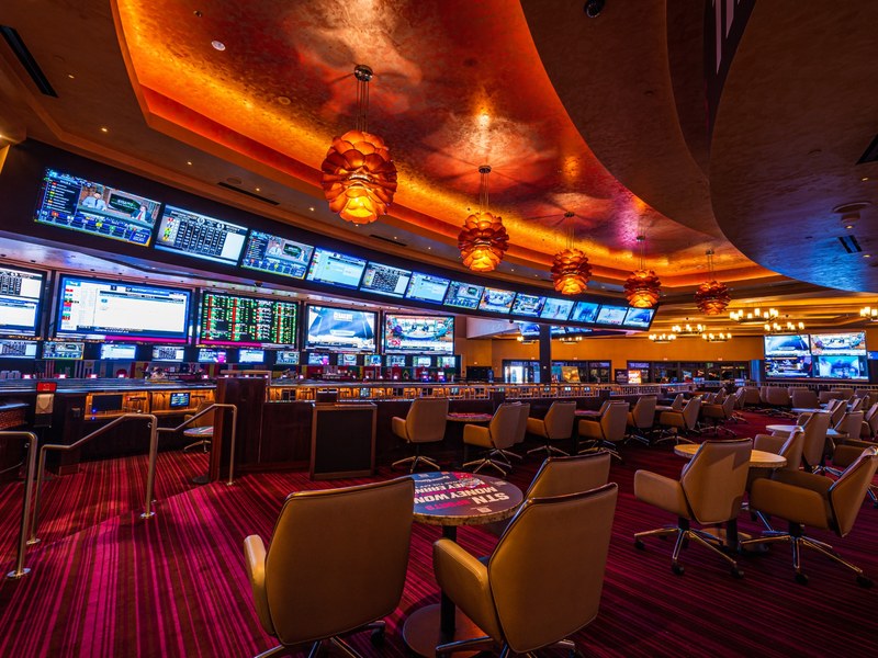 Santa Fe Station’s sportsbook surrounds guests with large displays, betting screens and comfortable seating for game-day action.