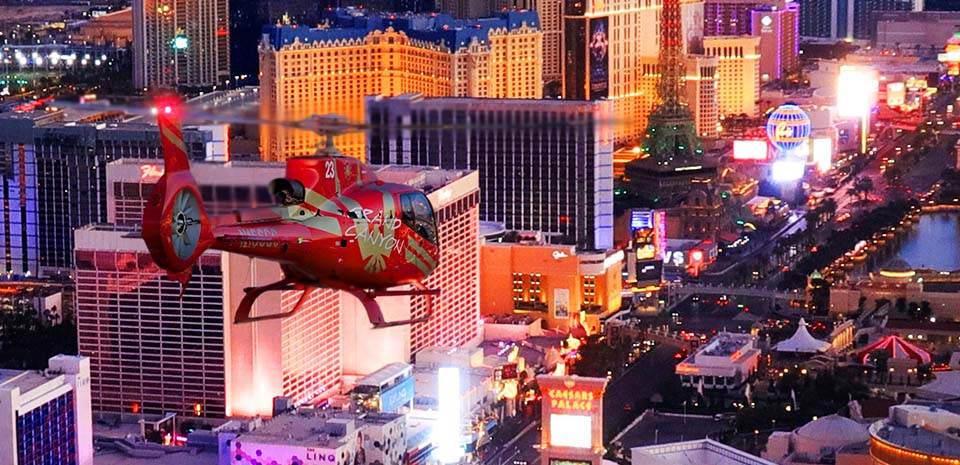Papillon helicopter night flight over the lit Las Vegas Strip