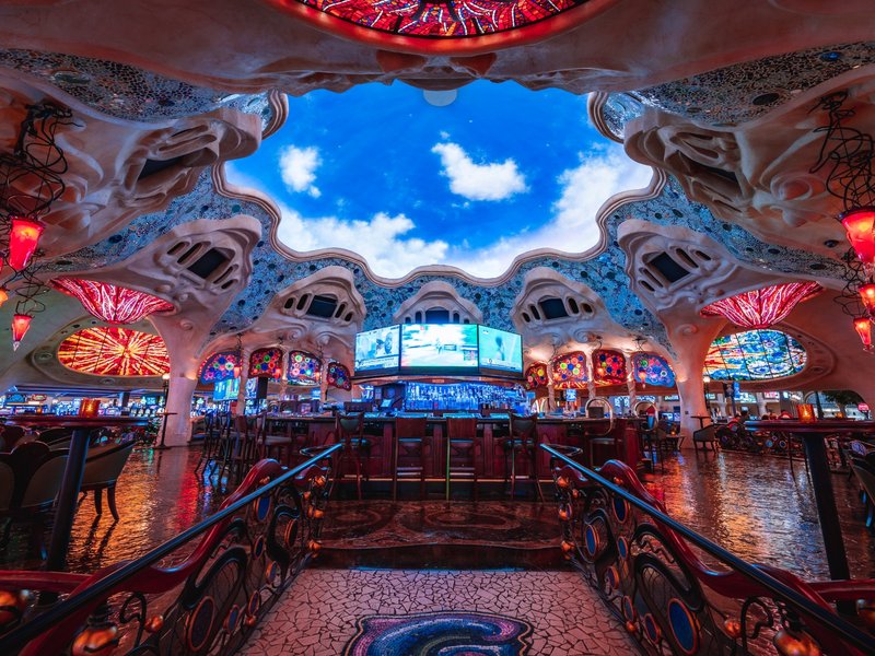 Gaudi Bar surrounds guests with sculptural architecture, stained-glass accents and a dramatic sky ceiling in the heart of the casino.