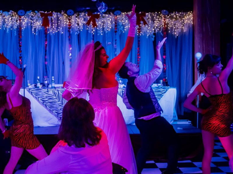 Tony n' Tina's Wedding - The bride and wedding party keep the celebration going with lively musical moments.