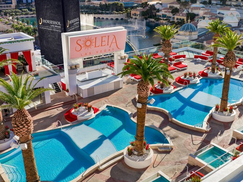 A bird's-eye view reveals Soleia's distinctive pool layout, private spa pools, and stylish rooftop setting.