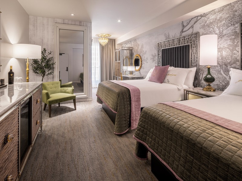 Another look at the spacious Two Queen room, blending boutique luxury with modern comfort.