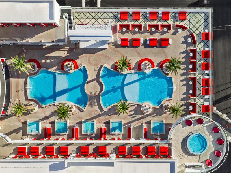 A sweeping perspective highlights the rooftop oasis, designed for lounging, swimming, and soaking up the Las Vegas sunshine.