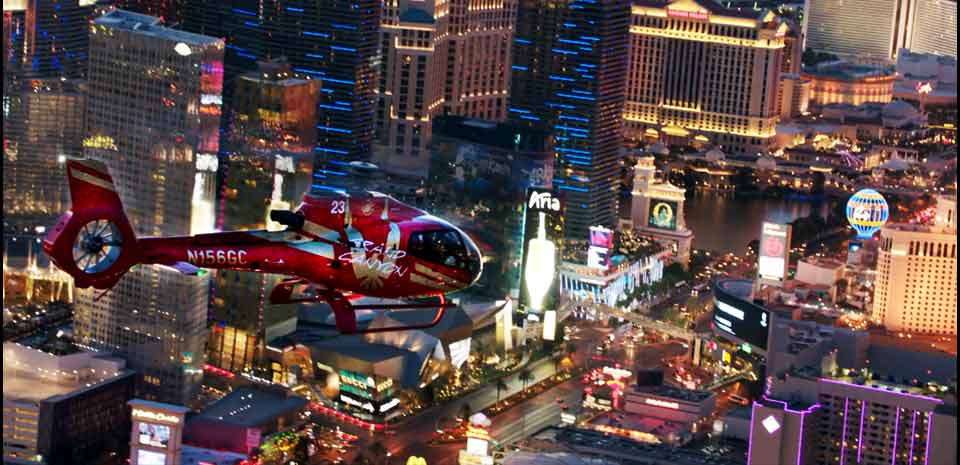 Strip Highlights Night Flight helicopter over Las Vegas Strip at night